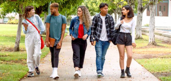 high school students walking together down a path