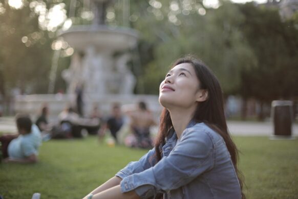 female asian high school student looking up