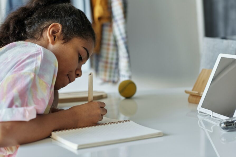 african american female student doing homework in her dedicated learning space