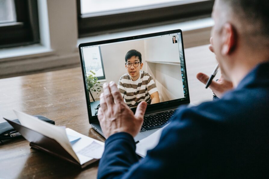 teacher talking to virtual student and answering questions