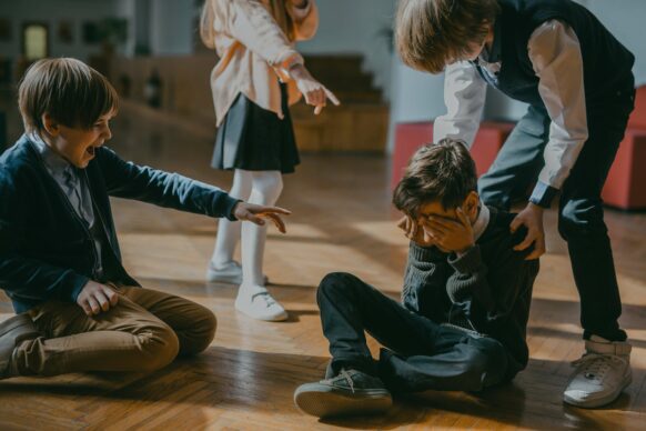 Boy crying while being pointed at