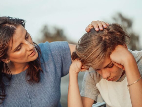 woman comforting child
