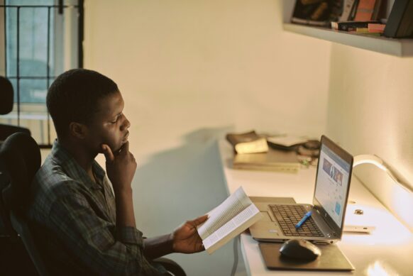 african american male doing homework for virtual school in oregon