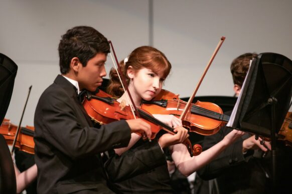 students playing violin as an extracurricular