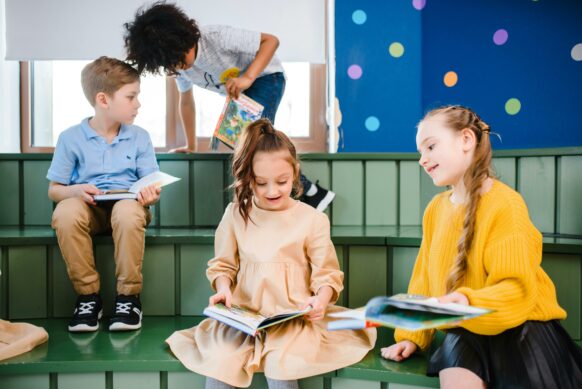 young kids reading together