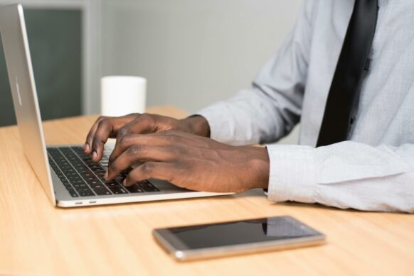 teacher writing a letter of recommendation for an online student