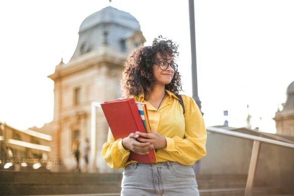 student wearing a yellow blouse