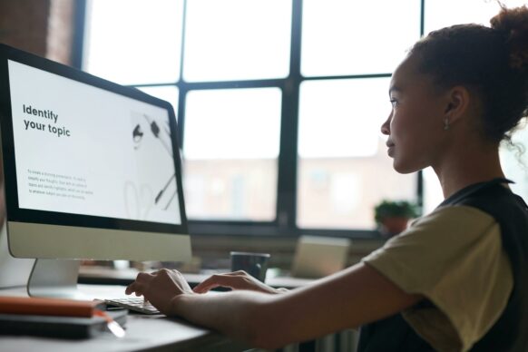 african american female student doing homework online